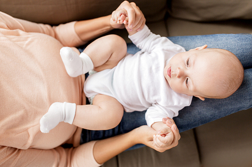 family, motherhood and people concept - mother with little baby boy at home