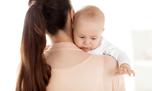 family, motherhood and people concept - close up of little baby boy with mother