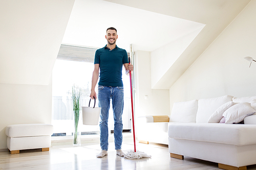household, housework and people concept - happy man with mop and bucket cleaning floor at home