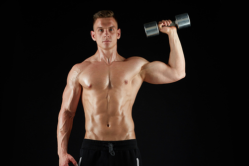 sport, bodybuilding, fitness and people concept - young man with dumbbells flexing muscles over black background