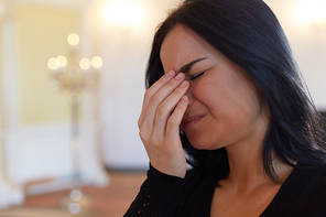 burial, people and mourning concept - close up of crying unhappy woman at funeral in church