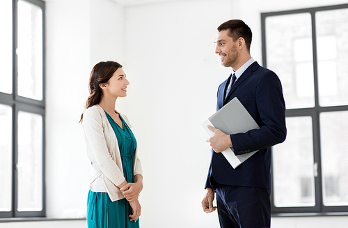 real estate business, sale and people concept - happy smiling realtor with folder meeting female customer at new office