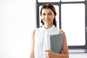 business, people and corporate concept - businesswoman or realtor with folder at office