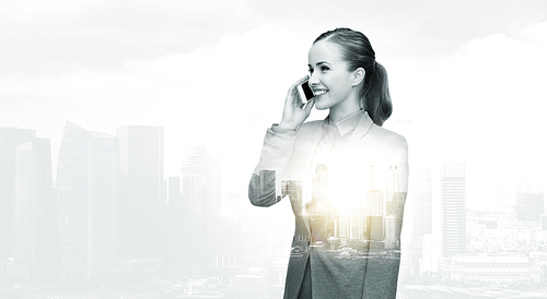 business, technology, communication and people concept - smiling businesswoman calling on smartphone over city buildings and double exposure effect