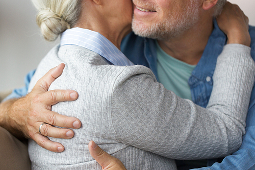 relationships, marriage and old people concept - close up of married senior couple hugging