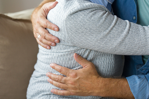 relationships, marriage and old people concept - close up of married senior couple hugging