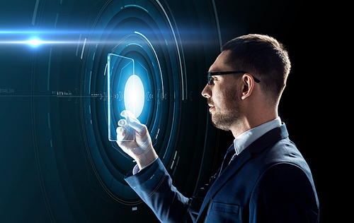 business, augmented reality and future technology concept - businessman in glasses working with transparent tablet pc computer and hologram over black background