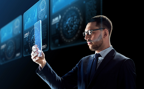 business, augmented reality and future technology concept - businessman in glasses working with transparent tablet pc computer and virtual screens projections over black background