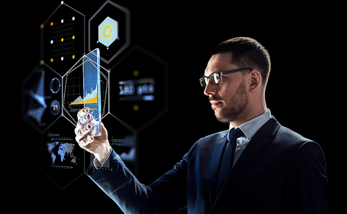 business, augmented reality and future technology concept - businessman in glasses working with transparent tablet pc computer and virtual screens projections over black background