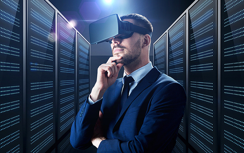 business, people and technology concept - businessman in virtual reality headset over futuristic server room background