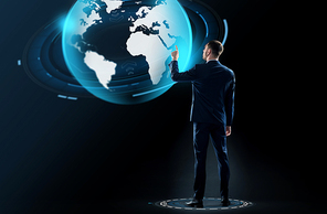 business, people and technology concept - businessman in suit touching earth globe hologram over black background