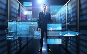 business, people and technology concept - businessman in suit with charts on virtual screen over server room background