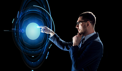 business, people and technology concept - businessman in suit with virtual projection over black background