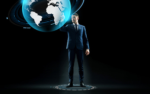 business, people and technology concept - businessman in suit touching earth globe hologram over black background