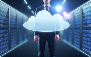 business, people and technology concept - businessman in suit with virtual cloud hologram over server room background