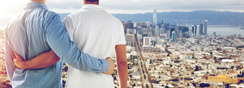 homosexual, same-sex marriage and tolerance concept - close up of happy male gay couple hugging over san francisco city view background