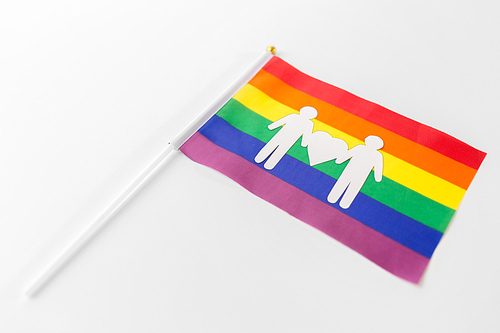 gay pride, homosexual and lgbt concept - rainbow flag with male couple white paper pictogram