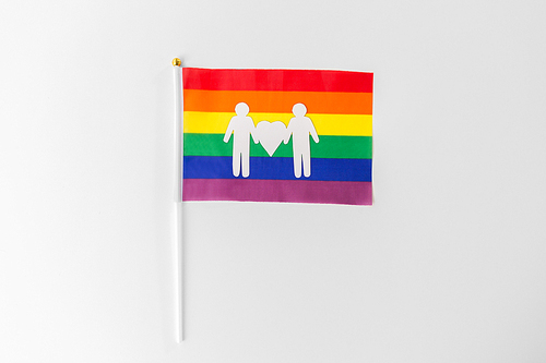 gay pride, homosexual and lgbt concept -  flag with male couple white paper pictogram