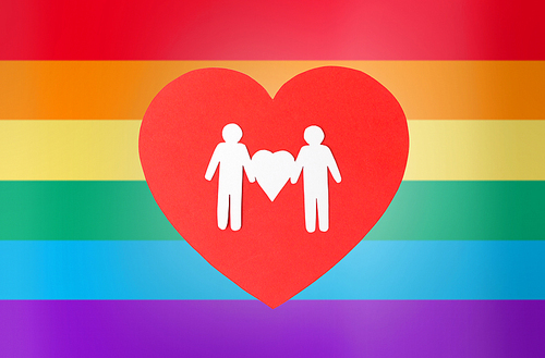 gay pride, homosexual, valentines day and lgbt concept - male couple white paper pictogram on red heart over rainbow background