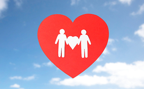 gay pride, homosexual, valentines day and lgbt concept - male couple white paper pictogram on red heart over blue sky background