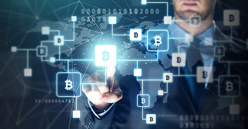 cryptocurrency, finance and business concept - close up of businessman with virtual bitcoin block chain hologram over binary code and blue background