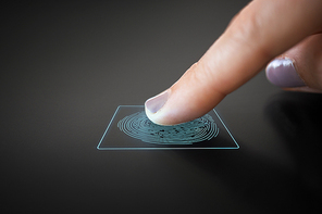 technology, security and identification concept - finger touching black interactive panel with fingerprint scanning system