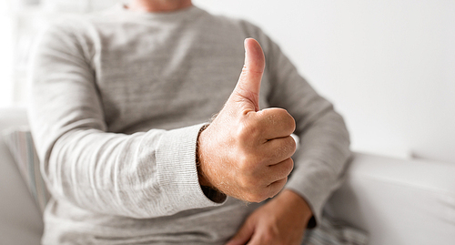 old age, gesture and people concept - close up of senior man showing thumbs up