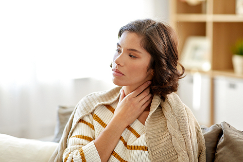 cold and health problem concept - unhappy sick woman with sore throat at home