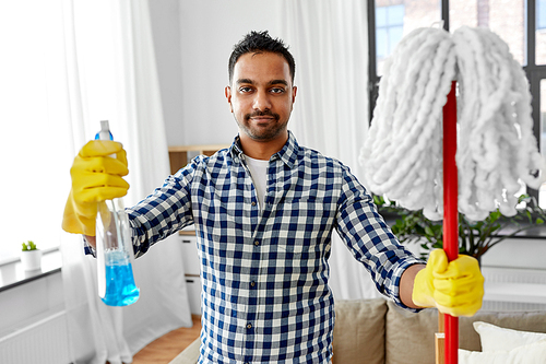 cleaning, housework and housekeeping concept - indian man with mop and detergent at home