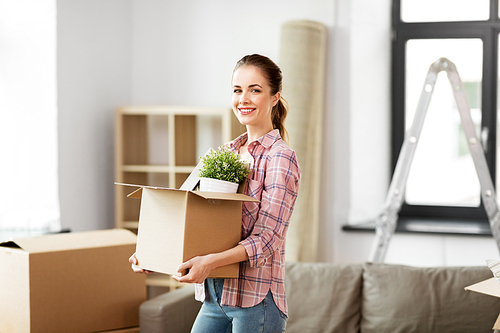 people, repair and real estate concept - smiling woman with stuff moving to new home