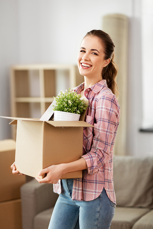 people, repair and real estate concept - smiling woman with stuff moving to new home