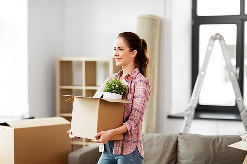 people, repair and real estate concept - smiling woman with stuff moving to new home