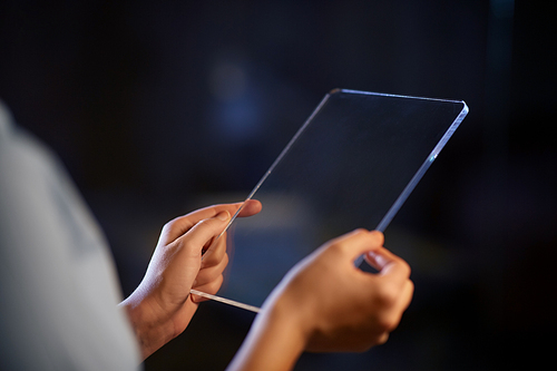 business, people and technology concept - close up of hands with transparent tablet pc computer