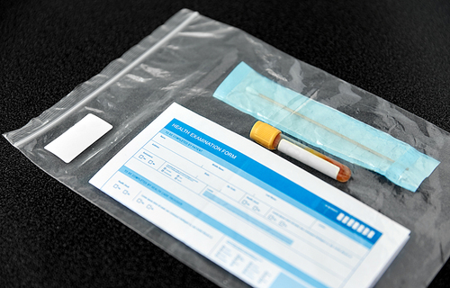 medicine, healthcare and pandemic concept - beaker with test, cotton swab and medical report in plastic zipper bag