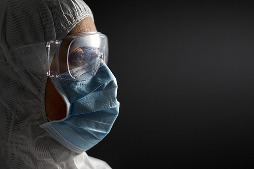 health safety, medicine and pandemic concept - close up of female doctor or scientist in protective wear, medical mask and goggles for protection from virus disease