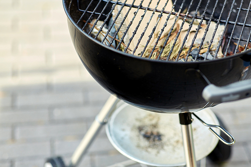 barbeque concept - close up of brazier outdoors