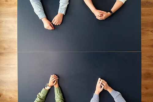 business, people and team work concept - hands of women sitting at office table