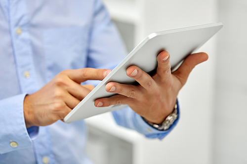 business, people and technology concept - close up of male hands with tablet pc computer