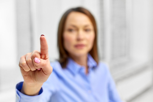 business and people concept - close up of businesswoman touching something with finger