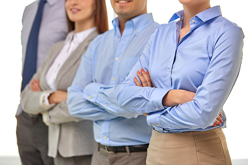 business and people concept - close up of happy smiling businesspeople at office