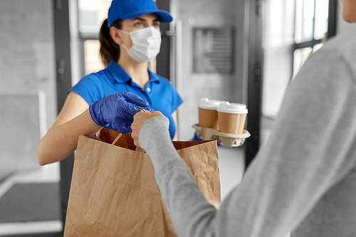health protection, safety and pandemic concept - delivery woman in protective face mask and gloves giving paper bag with food to female customer at office