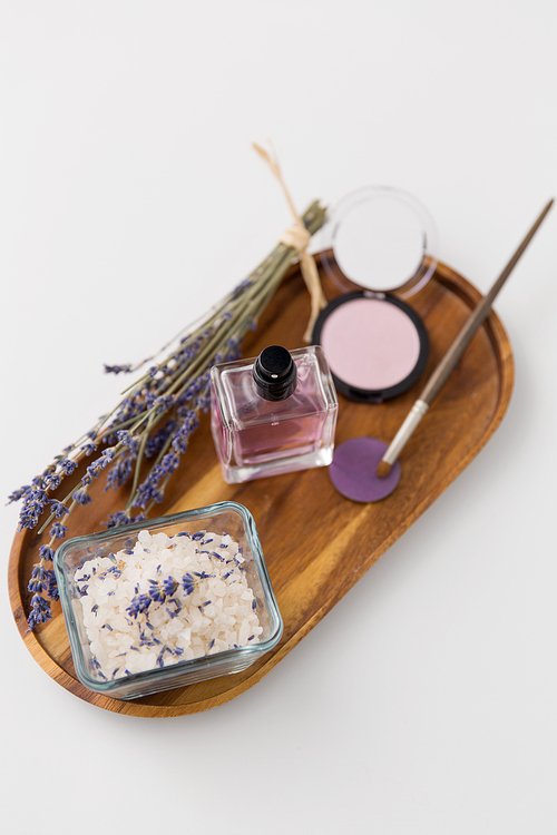 beauty, make up and wellness concept - 씨솔트, perfume, lavender and mineral cosmetics on wooden tray