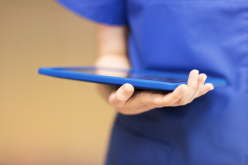 people, healthcare, medicine and technology - close up of female doctor or nurse hand holding tablet pc computer