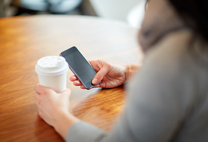drinks, people, technology and lifestyle concept - close up of woman with smartphone and coffee at cafe