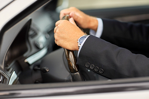 transport, business trip and people concept - senior businessman hands driving car