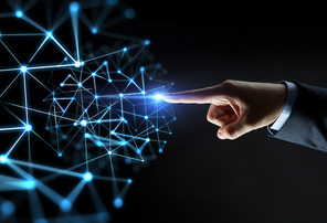 business, people, network and technology concept - close up of businessman hand pointing finger to polygonal virtual projection over black background