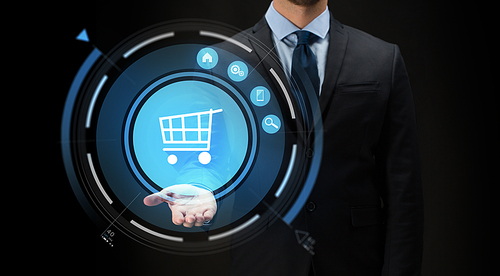business, e-commerce, future technology, cyberspace and people - close up of businessman with virtual shopping cart projection over black background