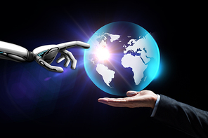 future technology, business and artificial intelligence concept - close up of businessman hand and robot touching virtual earth hologram over black background
