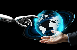 future technology, business and artificial intelligence concept - close up of businessman hand and robot touching virtual earth hologram over black background