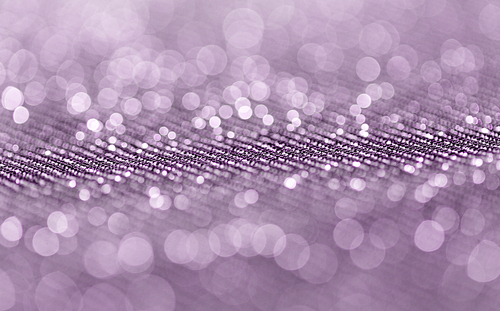 textile, party and texture concept - shimmering violet fabric background